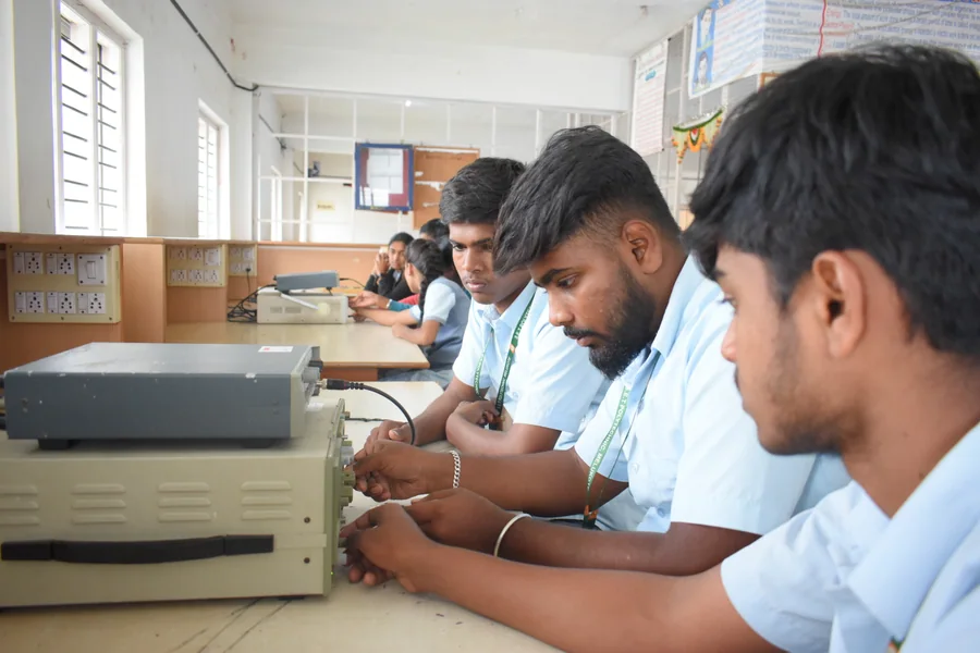 Students working with electronics lab equipment