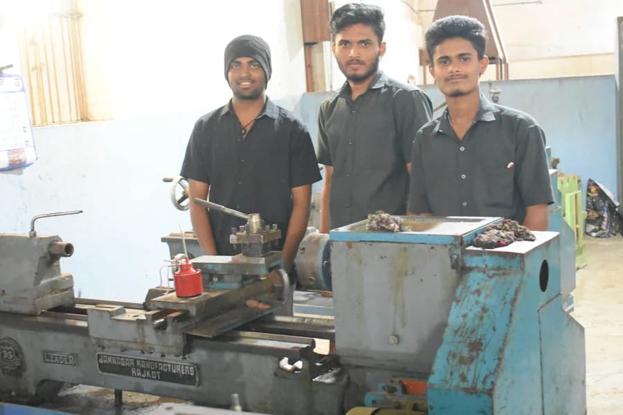Mechanical Engineering students at a lathe machine